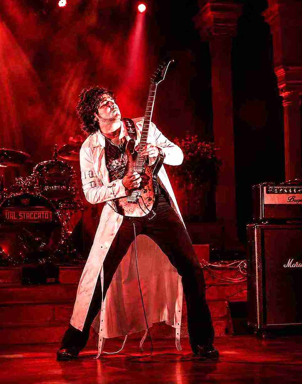 Val Staccato playing electric guitar live in Peru