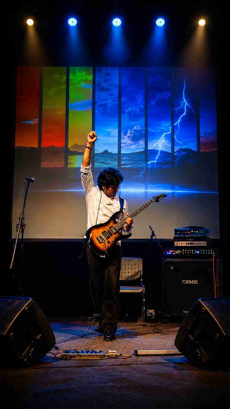Val Staccato performing Peruvian instrumental rock guitar concert inside a theater in Peru